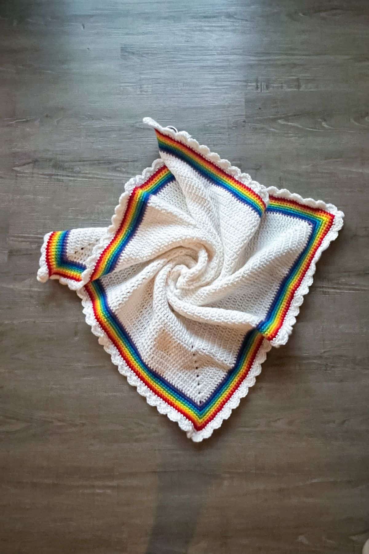 Finished crochet rainbow baby blanket.