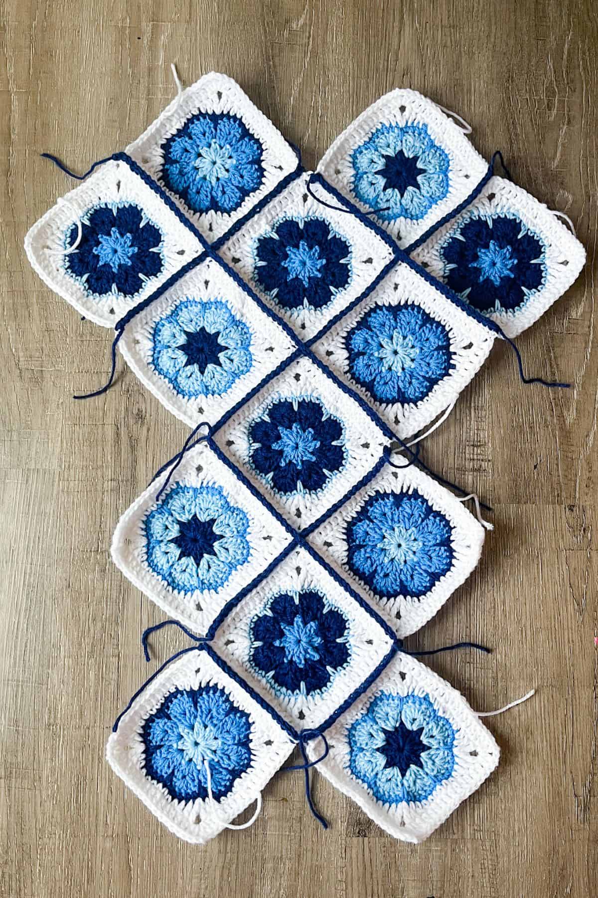 Slip stitch the granny squares together in the other direction.