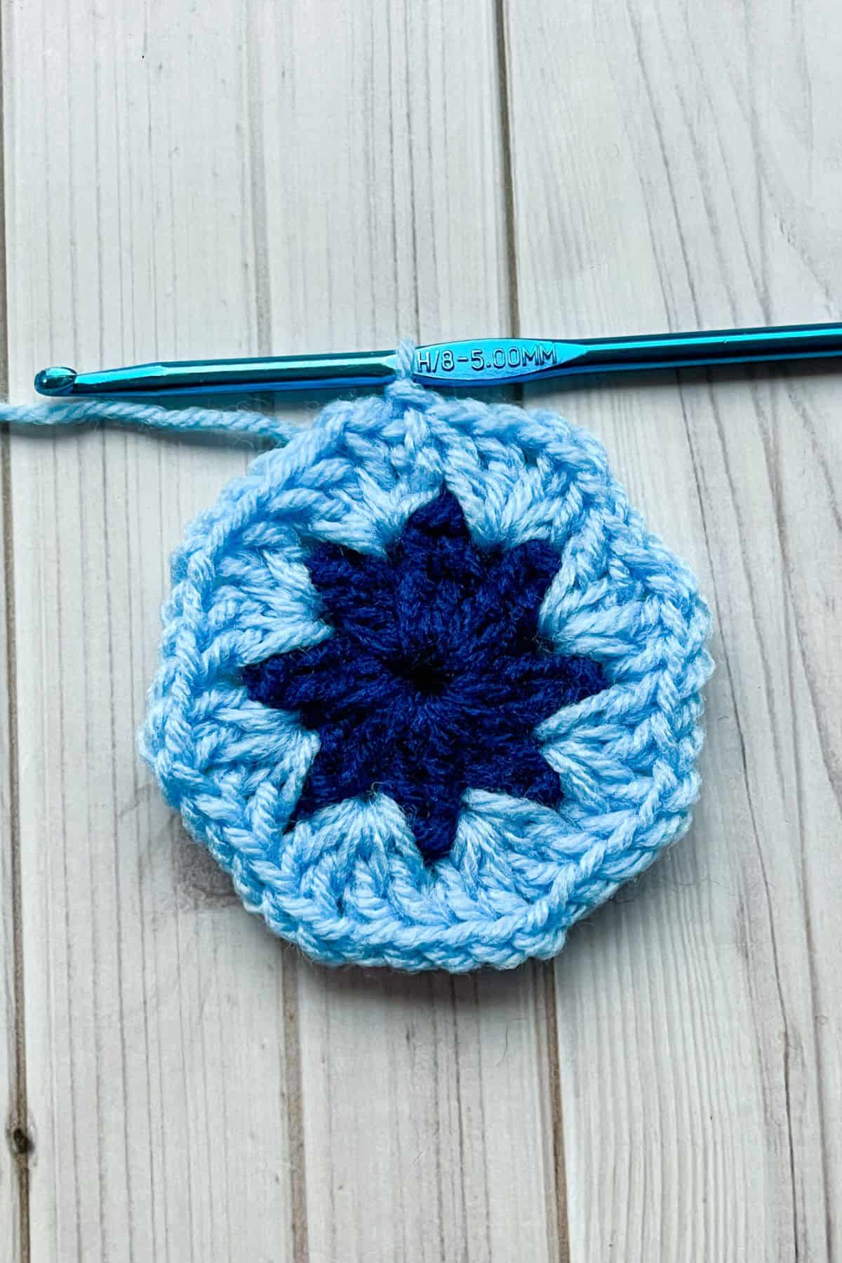 Second round of the 8 petal crochet African flower motif.