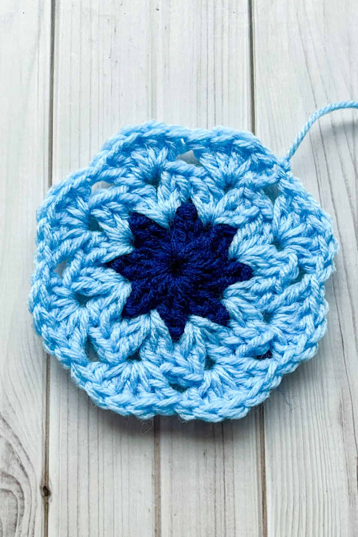 Third round of the 8 petal crochet African flower motif.
