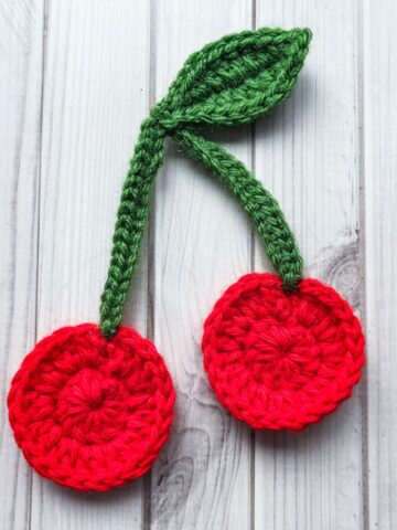 Finished crochet cherry applique pattern.