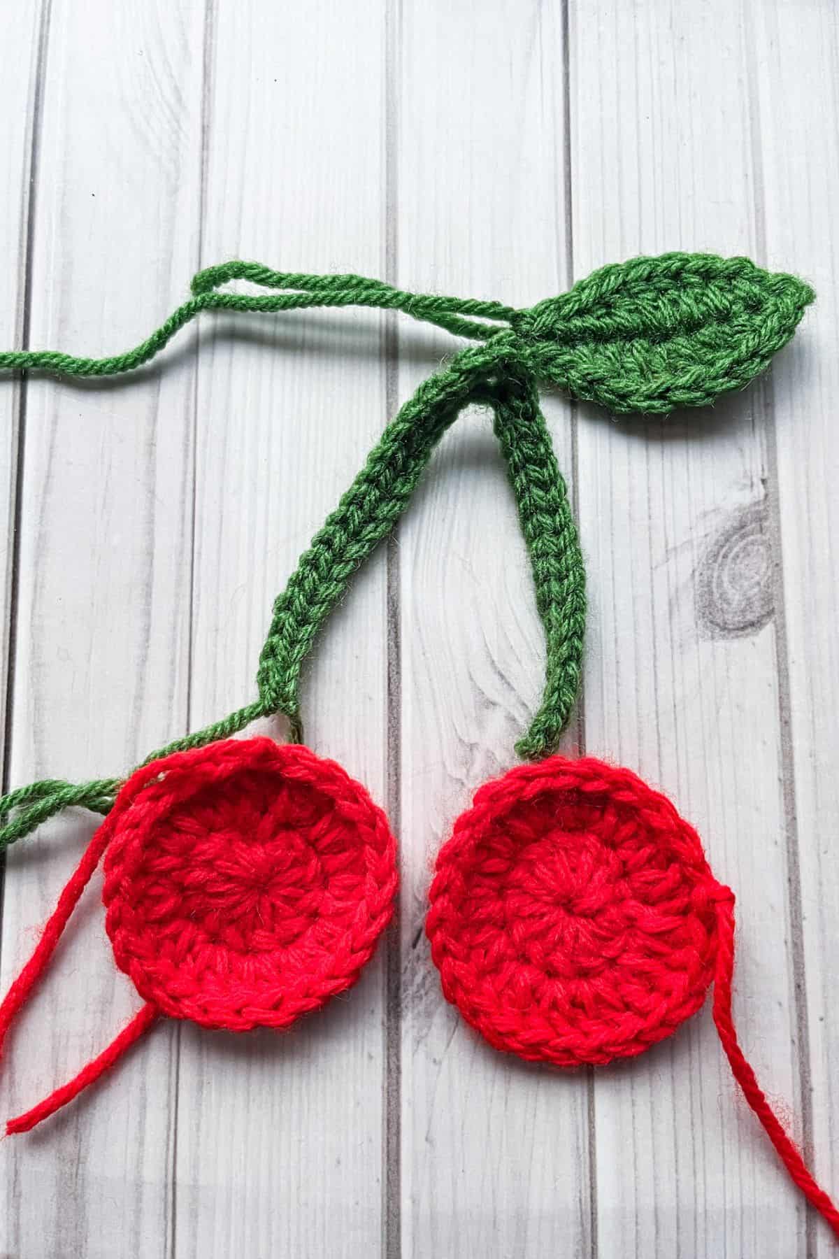 Layout of where to attach the pieces together to create the crochet cherry applique.