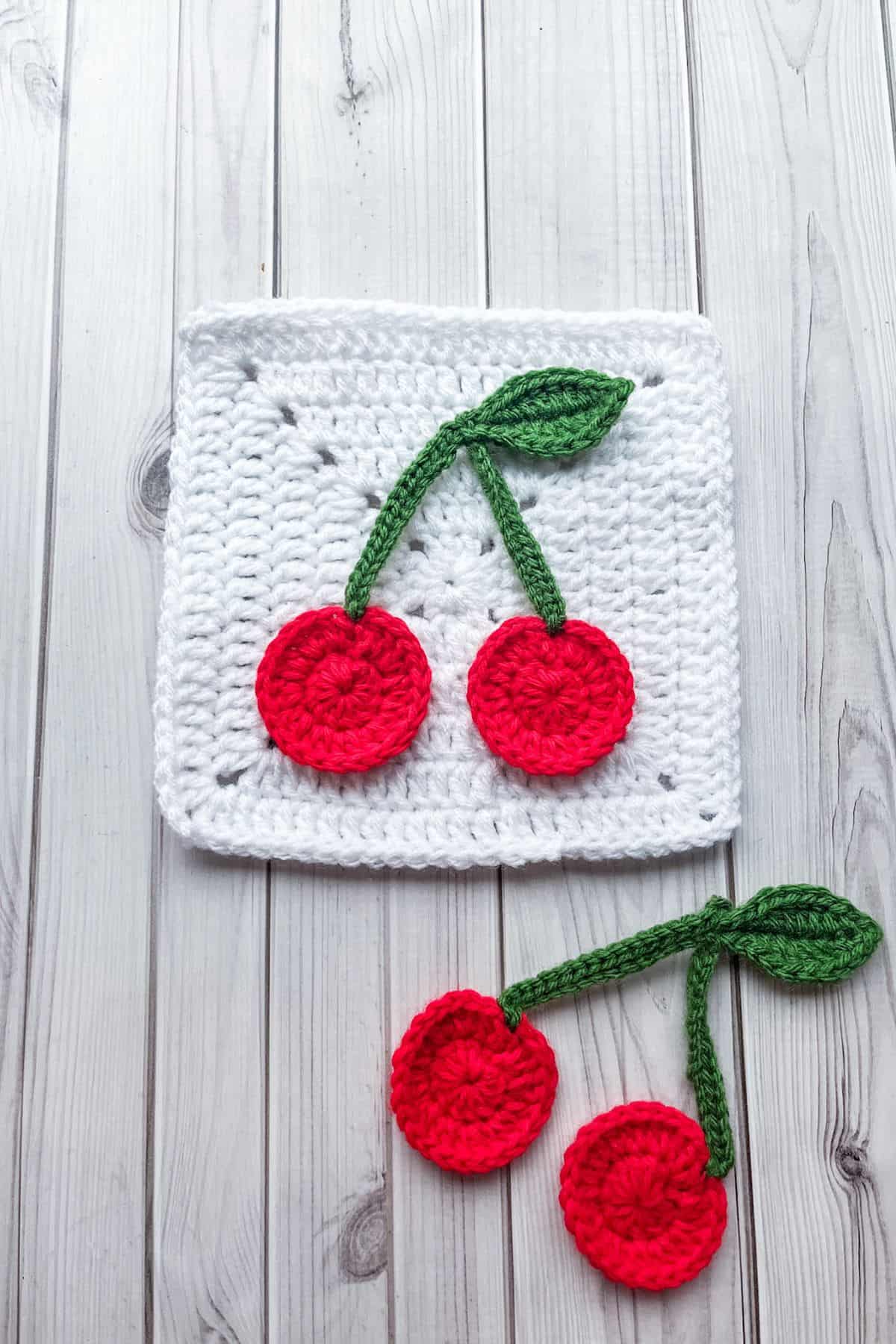 Finished crochet cherry applique.