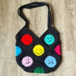 Finished crochet emoji bag pattern.