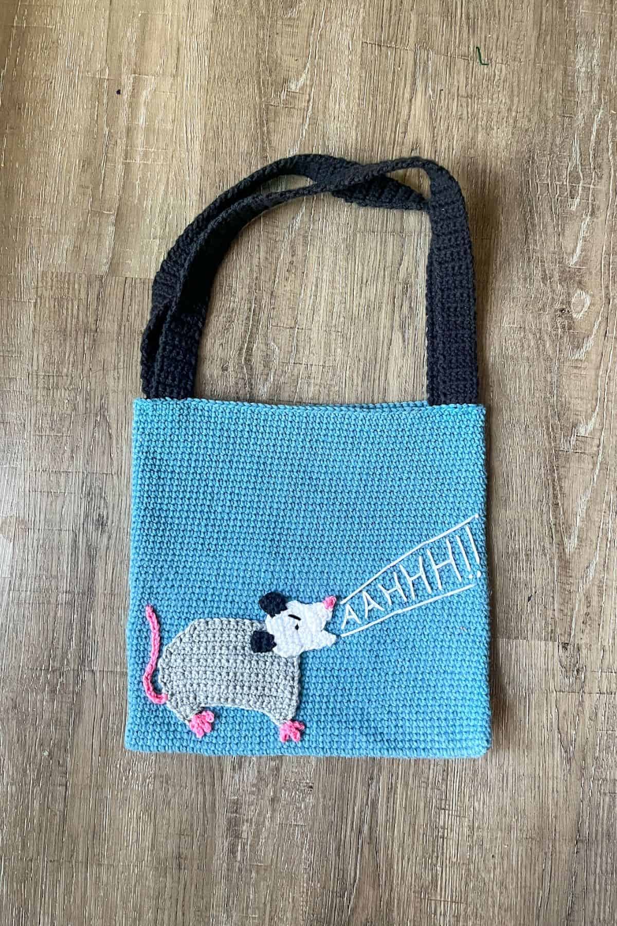 Finished crochet possum bag.