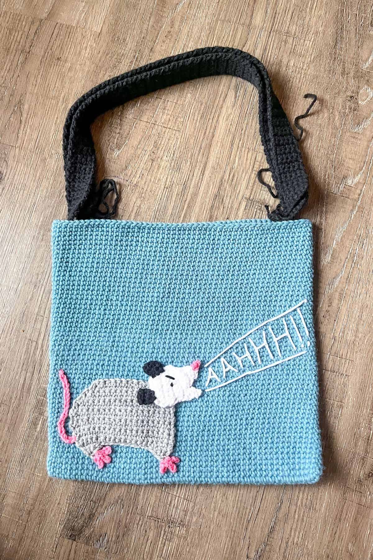 Finished crochet possum bag but still need to sew the handles on to the bag.