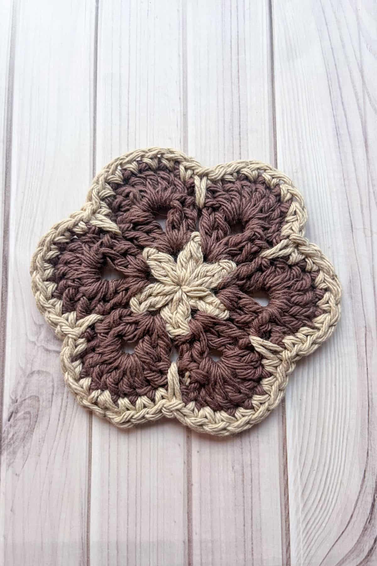 Fourth round of the 6 petal crochet African flower motif.