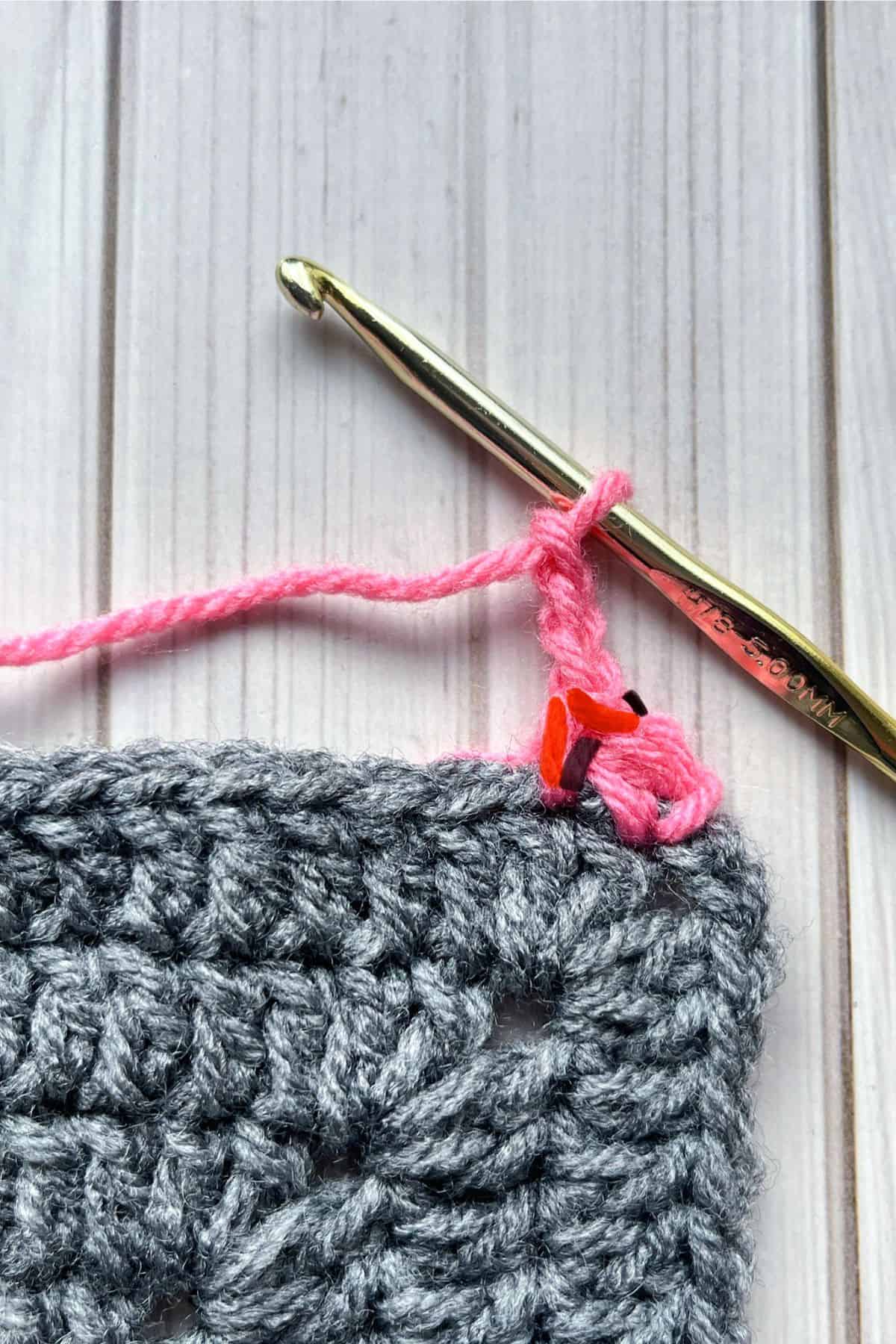 Insert hook into the red yarn lines.