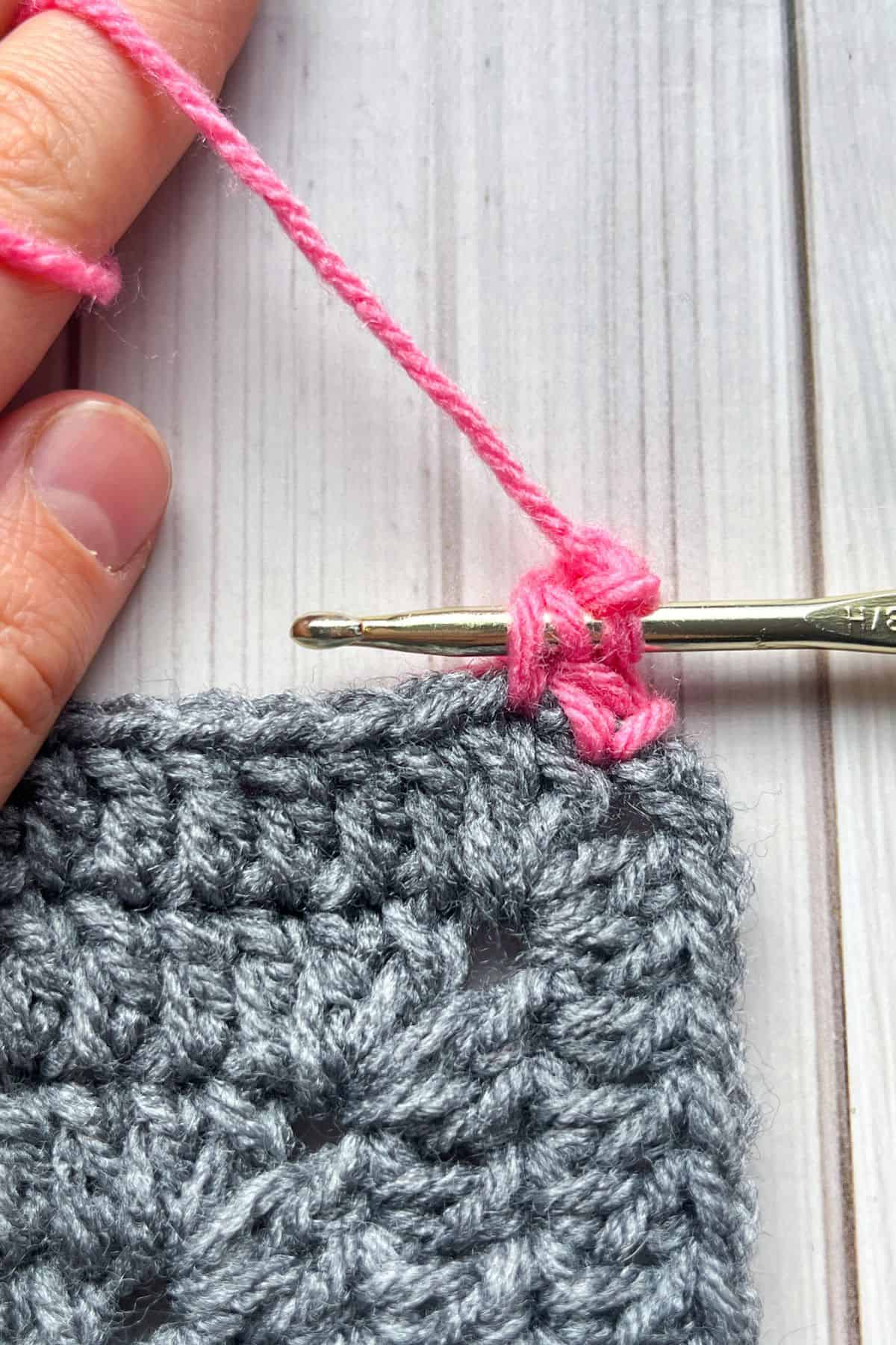 In the middle of making the crochet picot stitch.