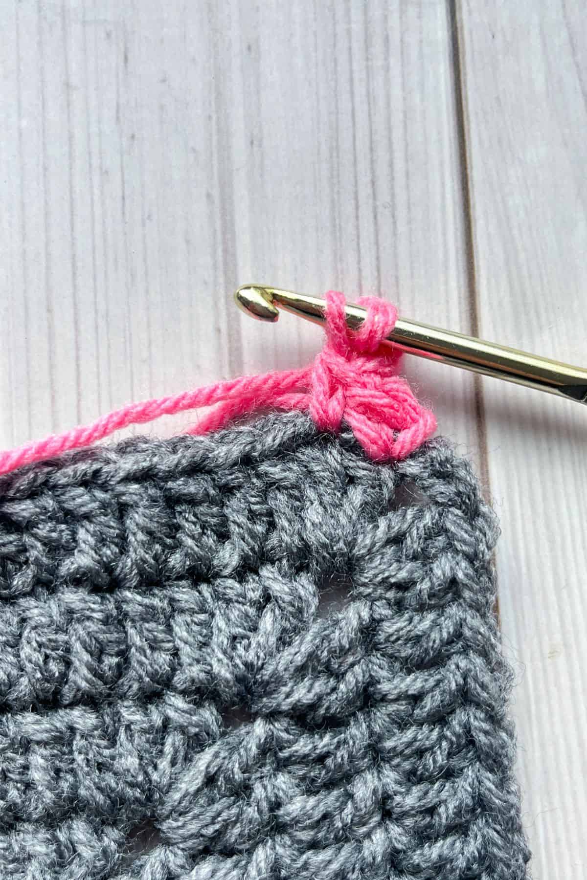 In the middle of making the crochet picot stitch.
