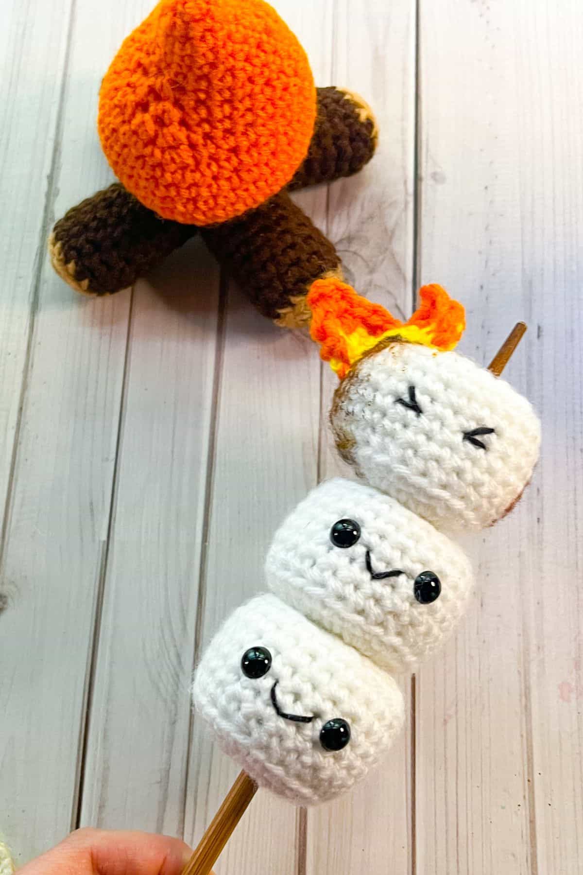Crochet marshmallow stick with crochet campfire.