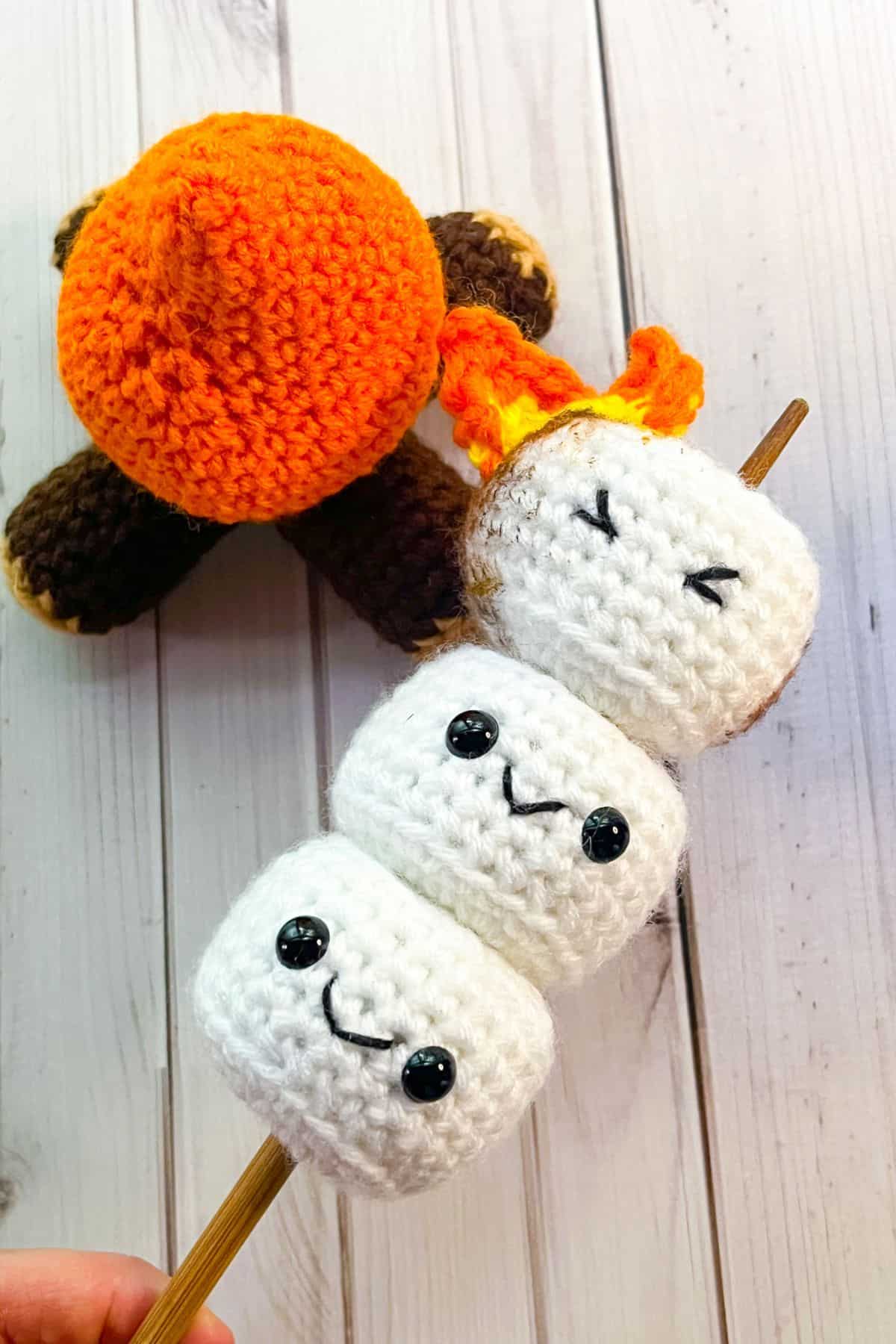 Crochet marshmallow stick with crochet campfire.