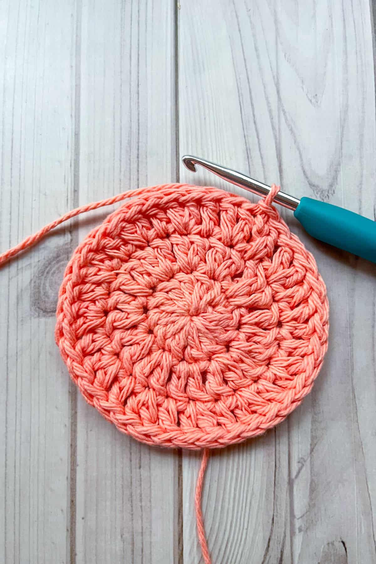 Third round of crochet for the coaster.