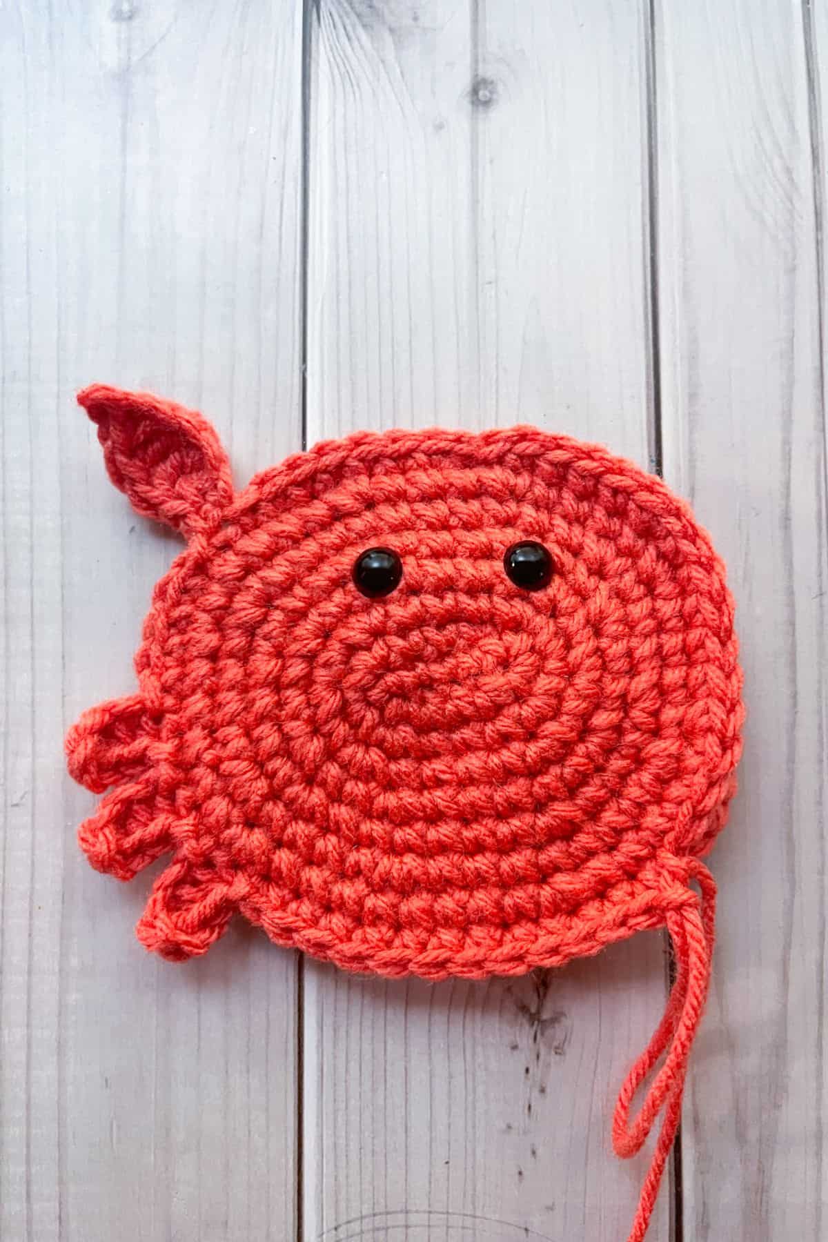 Crocheting the 3 crab legs on one side.