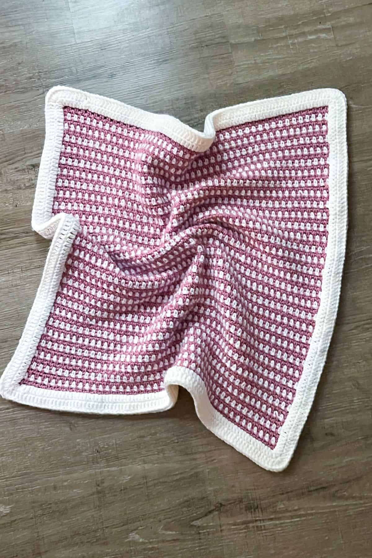Finished moss stitch crochet blanket.