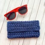 Crochet glasses case with glasses.