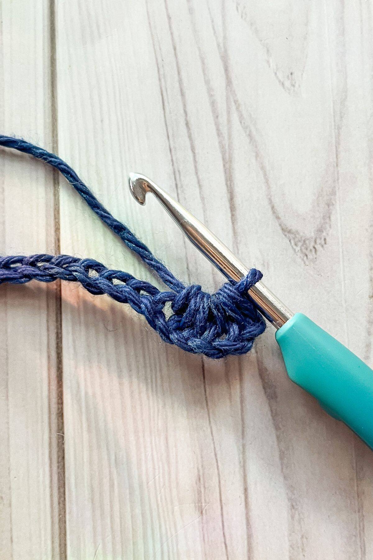 Making the crochet star stitch.