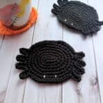 Finished crochet spider coaster.