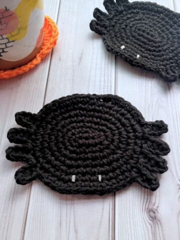 Finished crochet spider coaster.