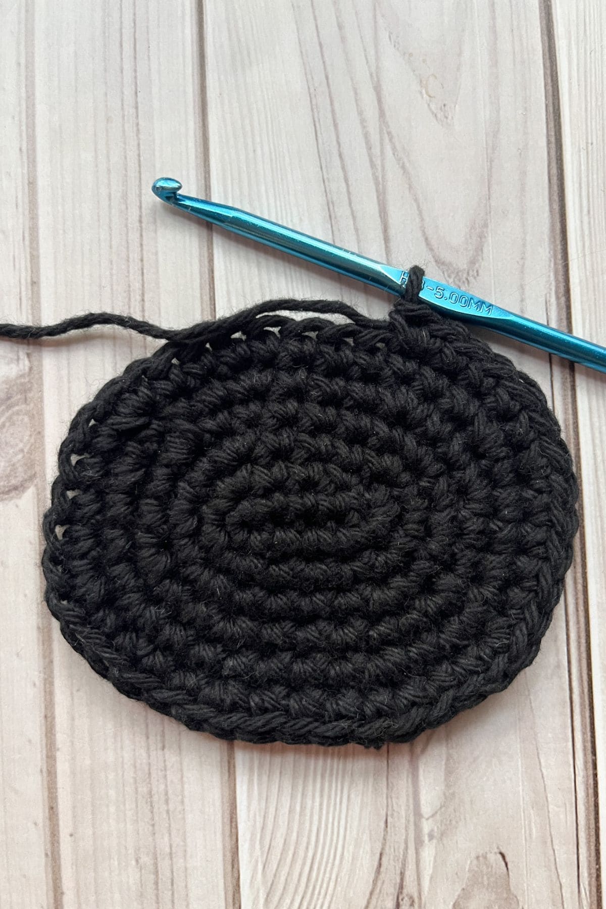Crocheting the spider coaster.