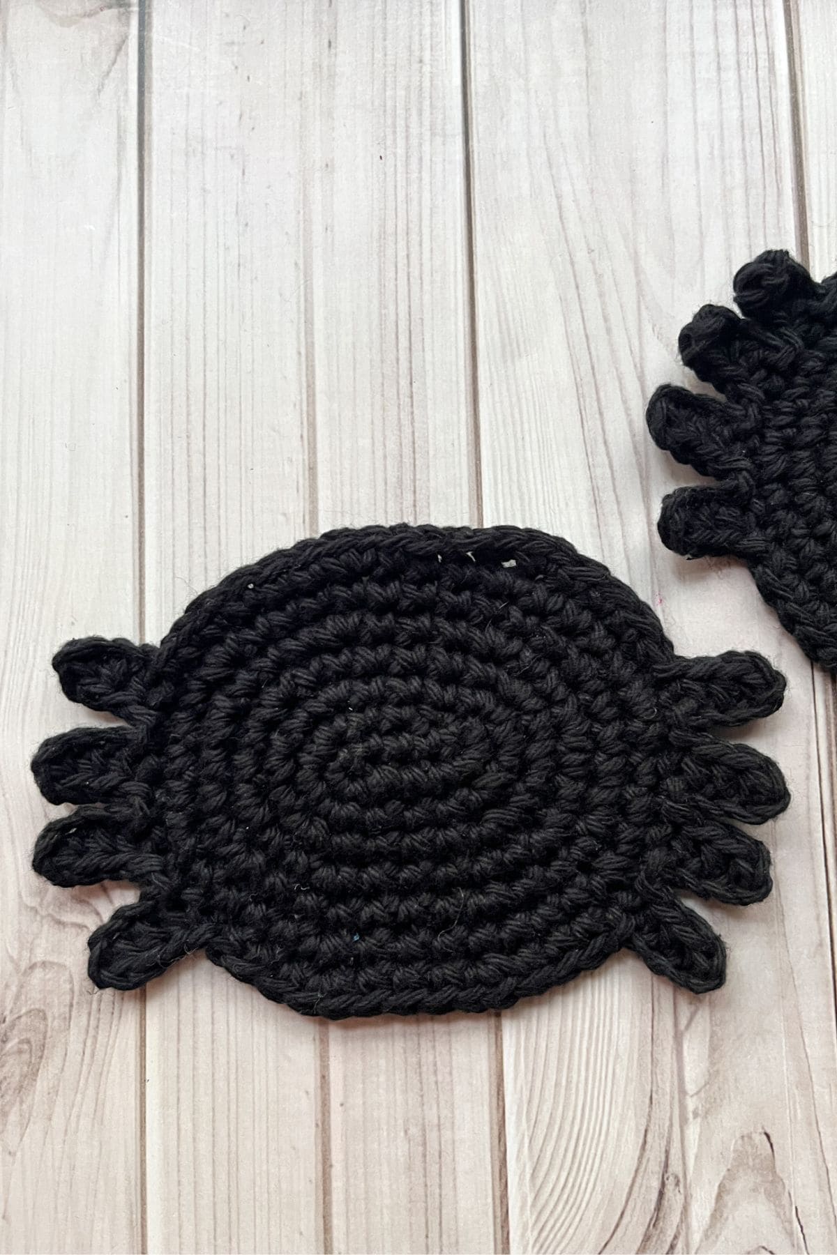 Crocheting the spider coaster.