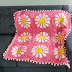 Finished crochet daisy blanket.