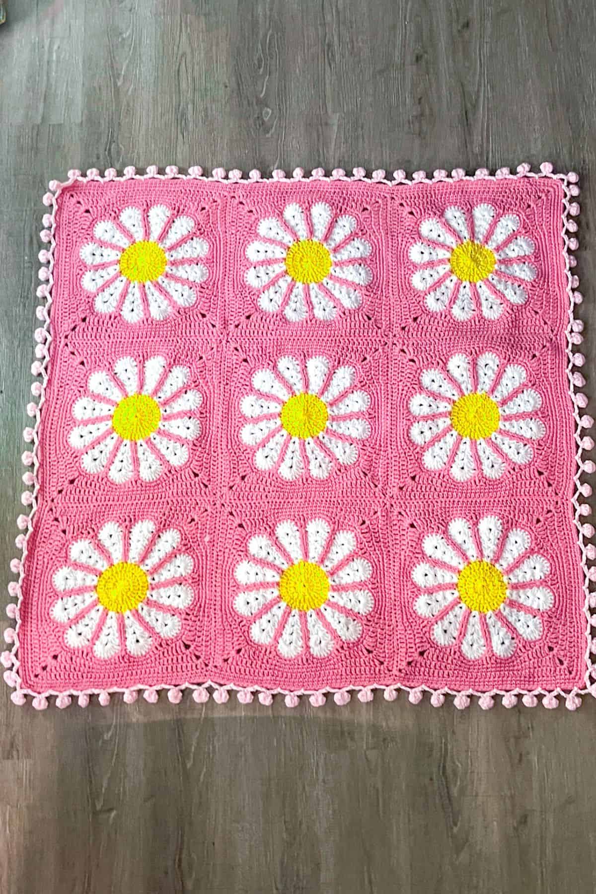 Finished crochet daisy blanket.