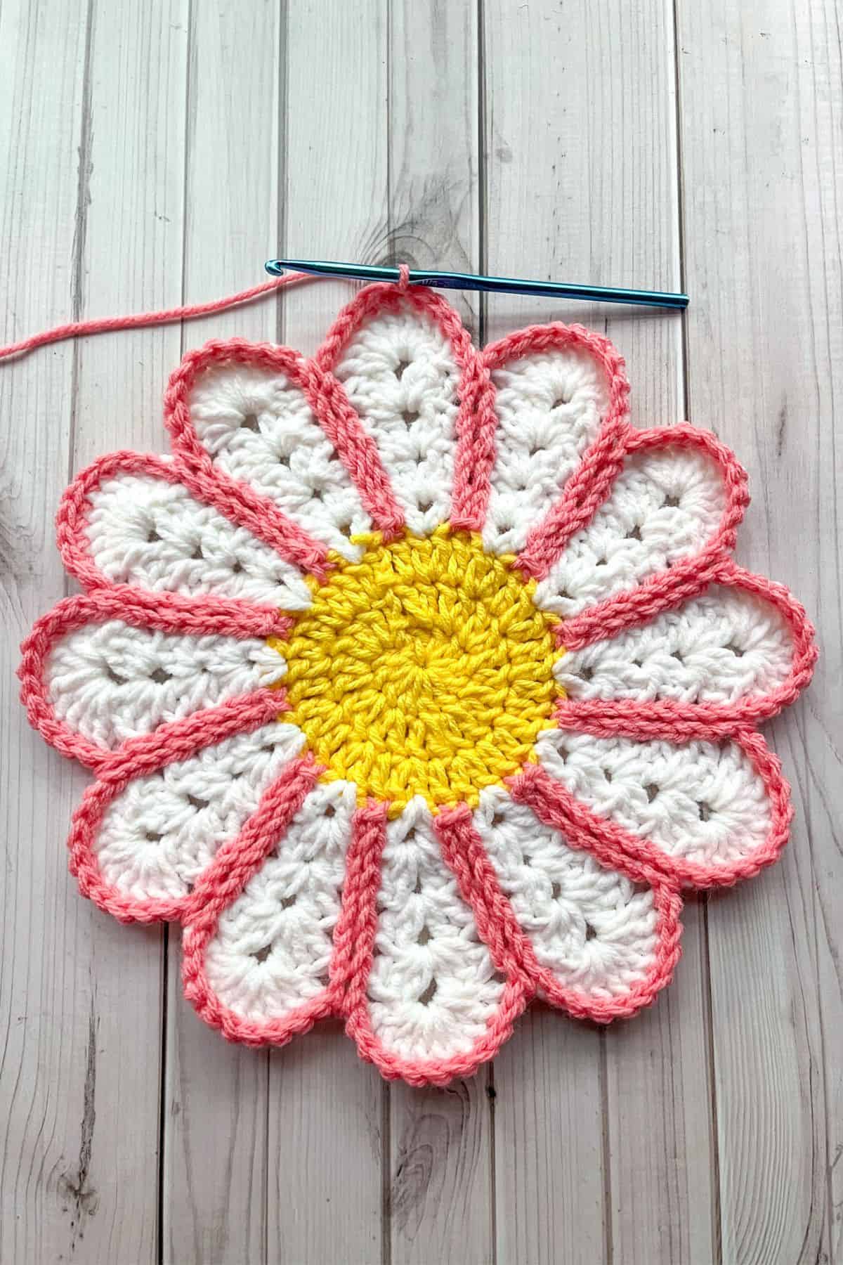 Finish outlining the crochet flower.