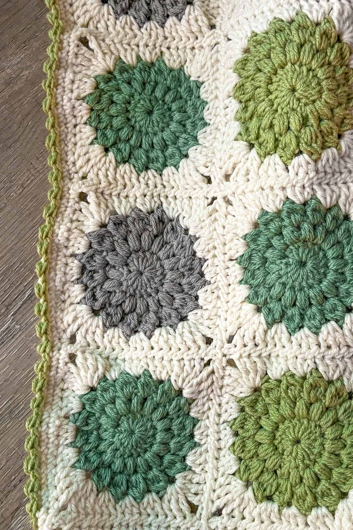 Finished granny square baby blanket.