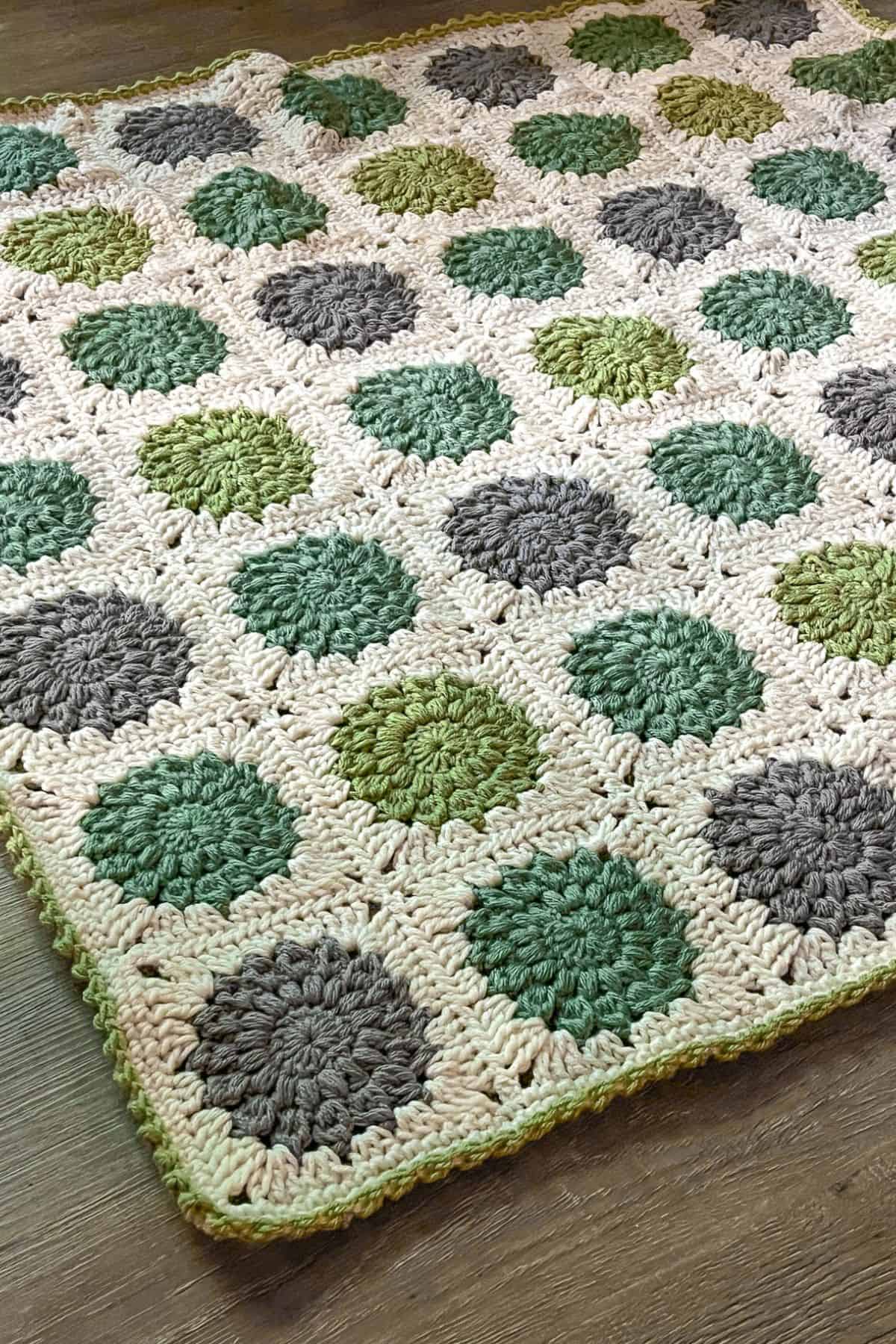 Finished granny square baby blanket.