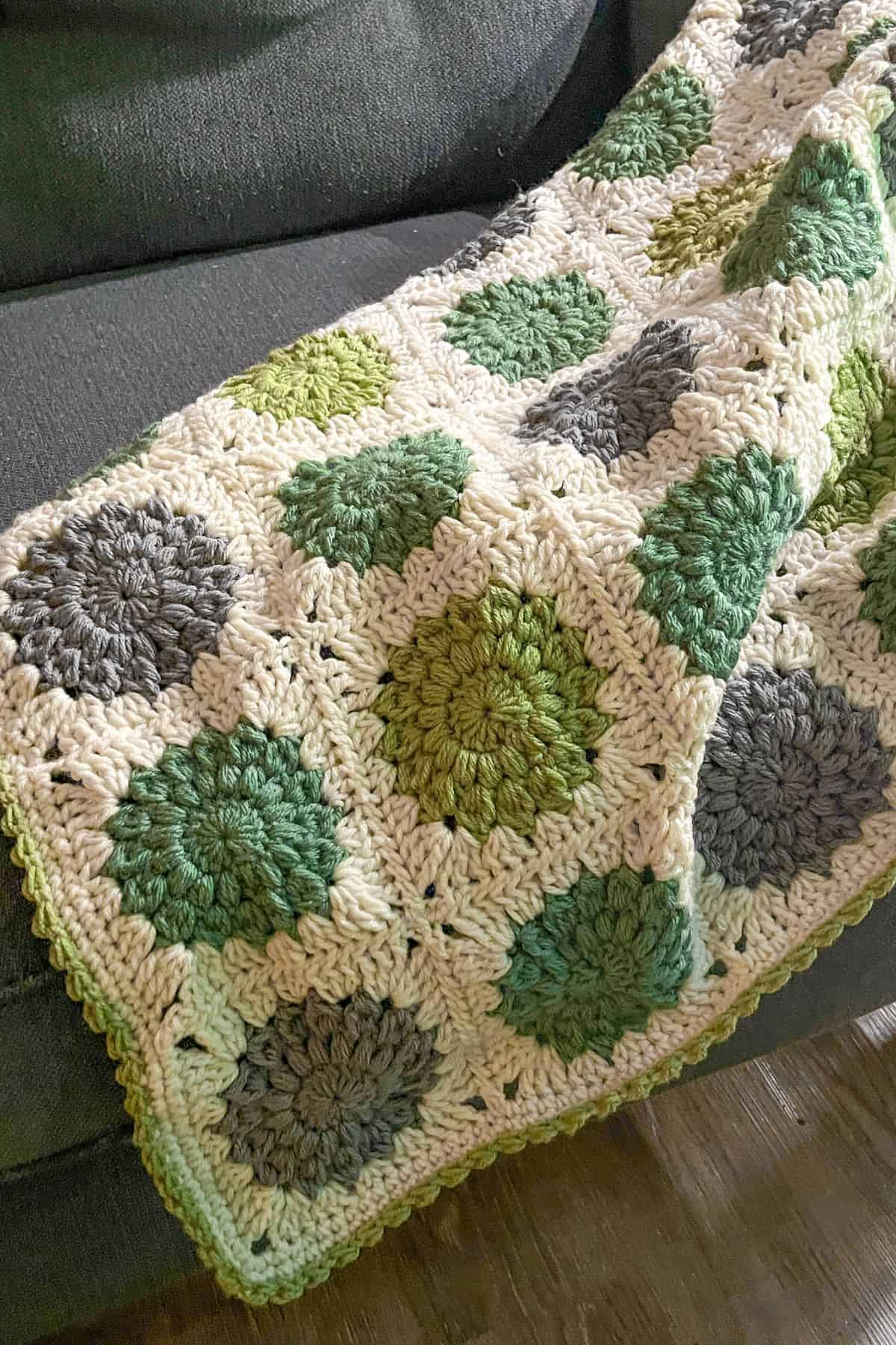 Finished granny square baby blanket.