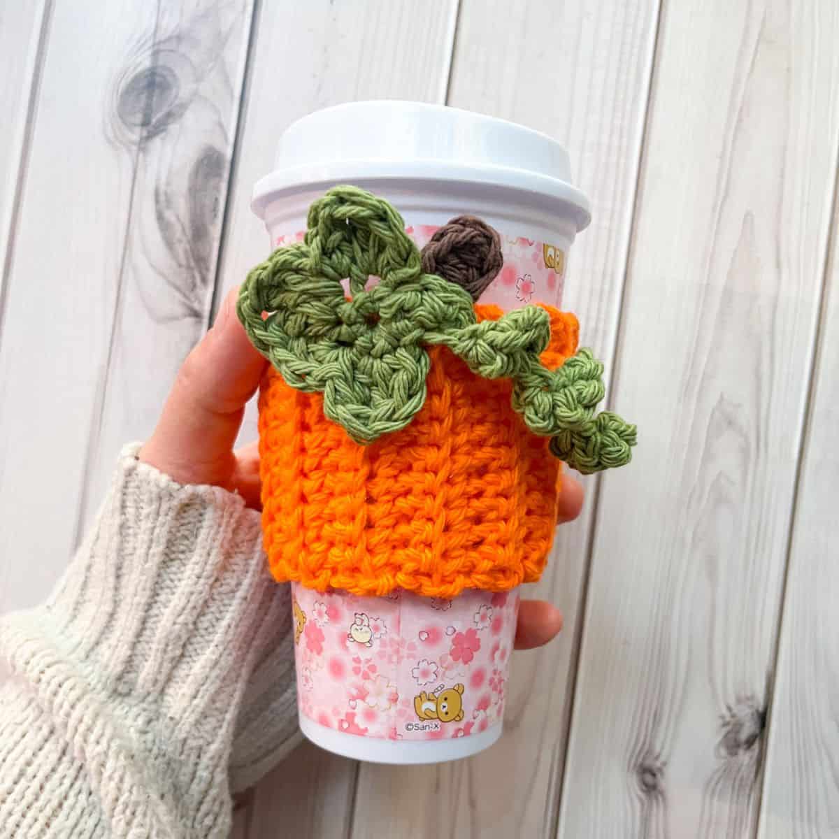 Finished crochet pumpkin cup cozy.