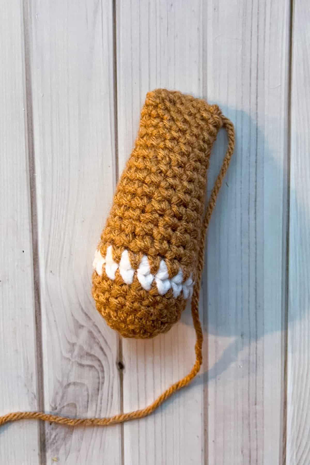 Finished crochet gingerbread arm.