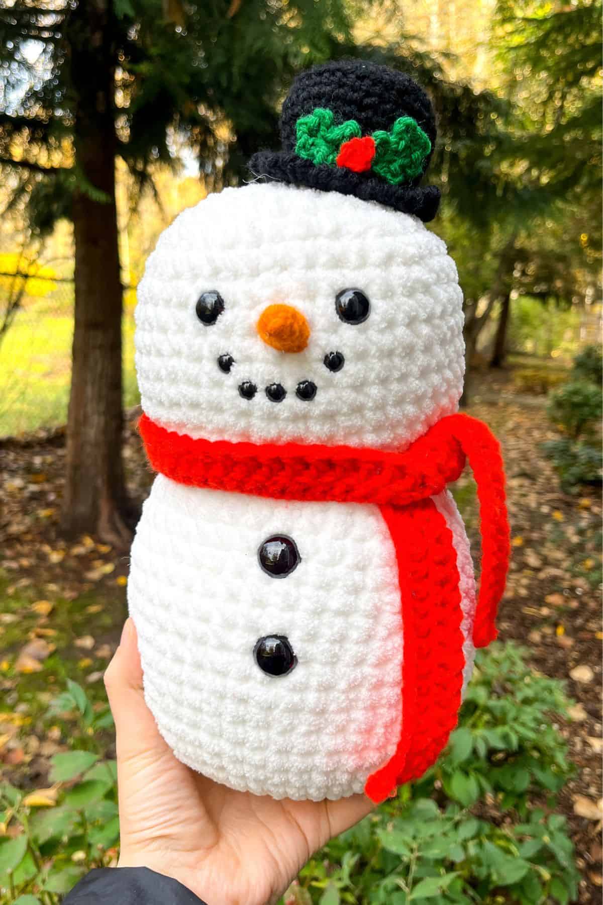 Finished crochet snowman outside.