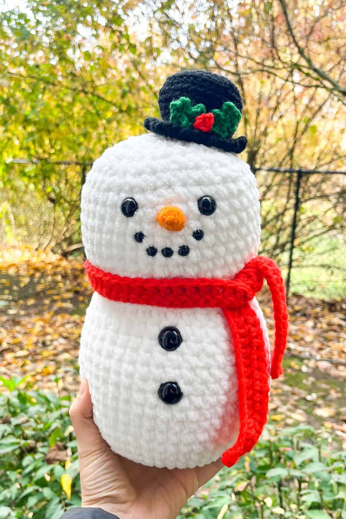Finished crochet snowman outside.