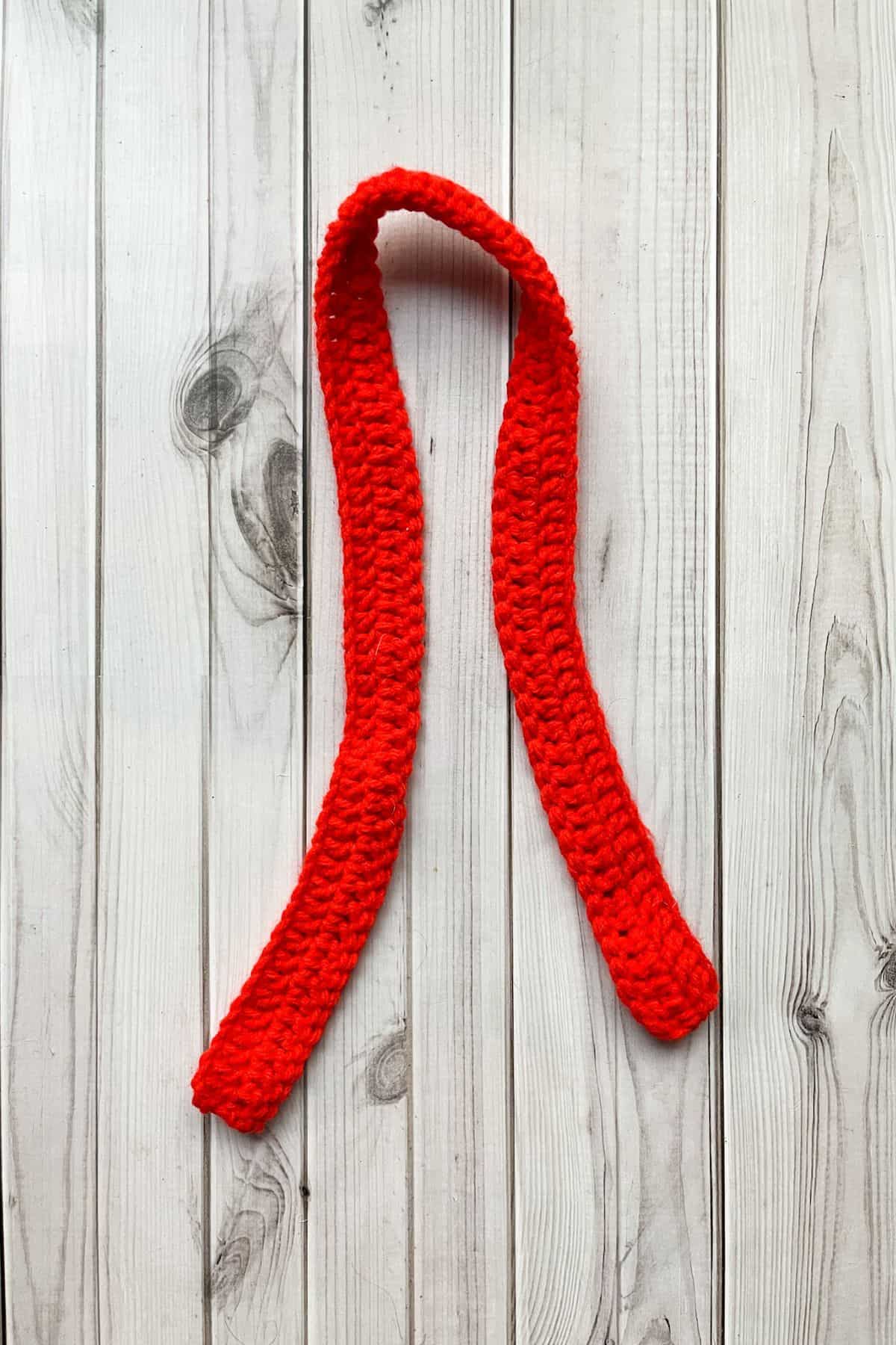 Crochet mini red scarf.