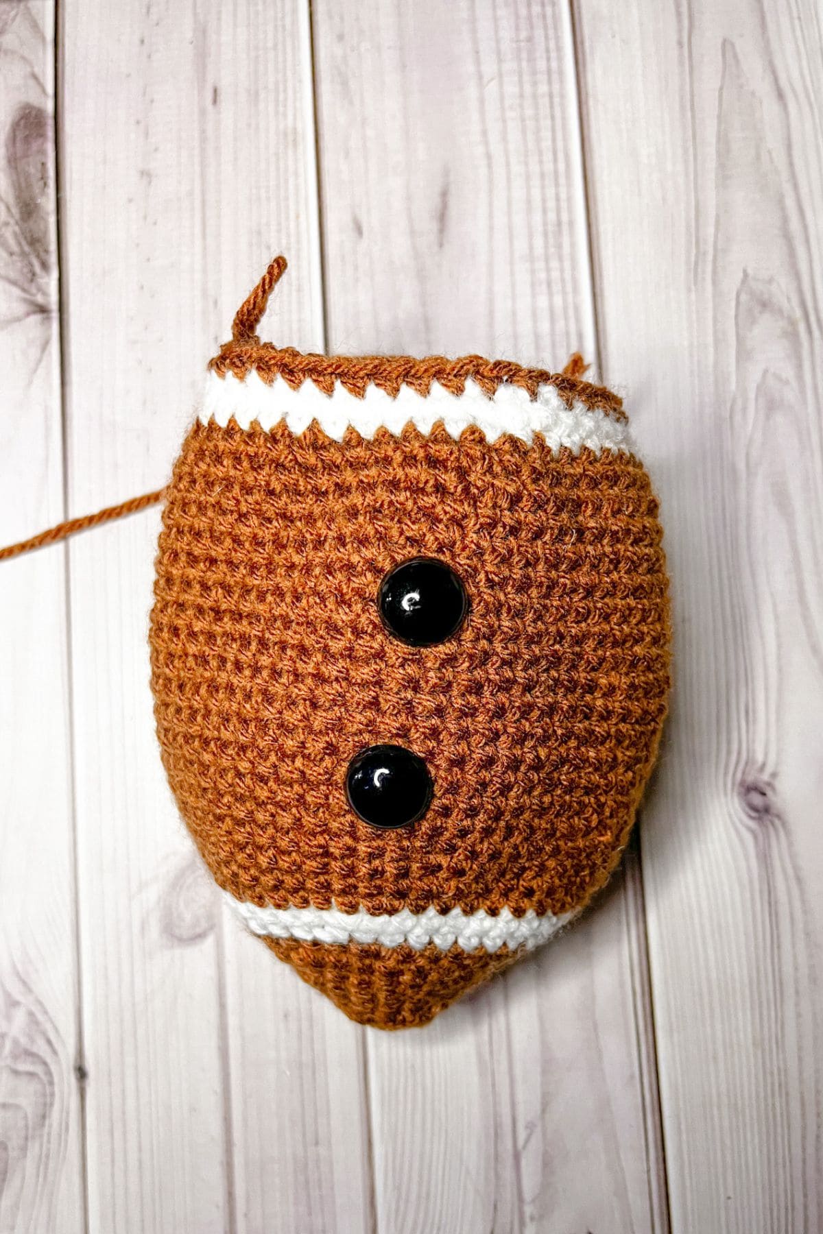 Starting to decrease the crochet football pattern.