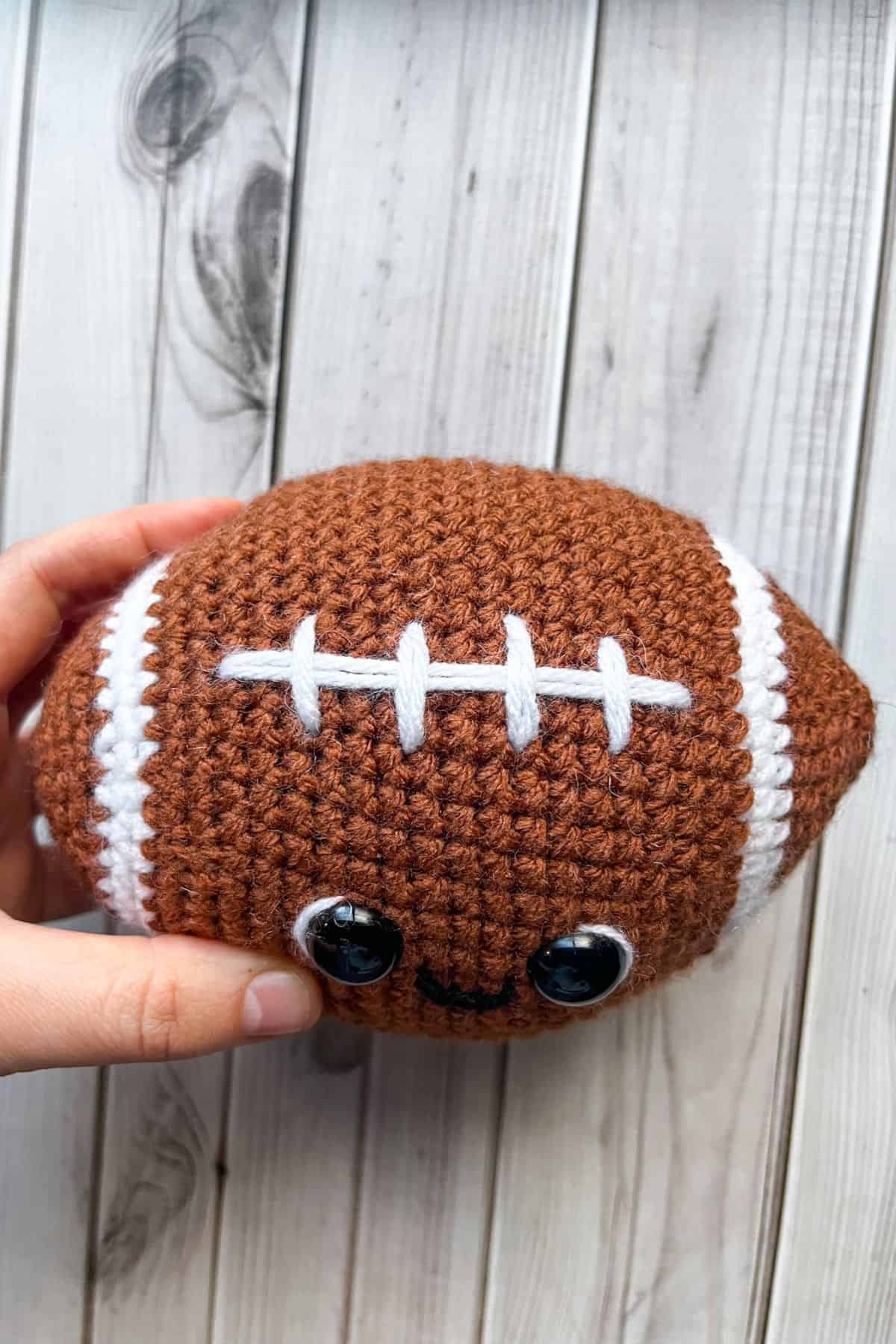 Embroidering the football stitch marks.