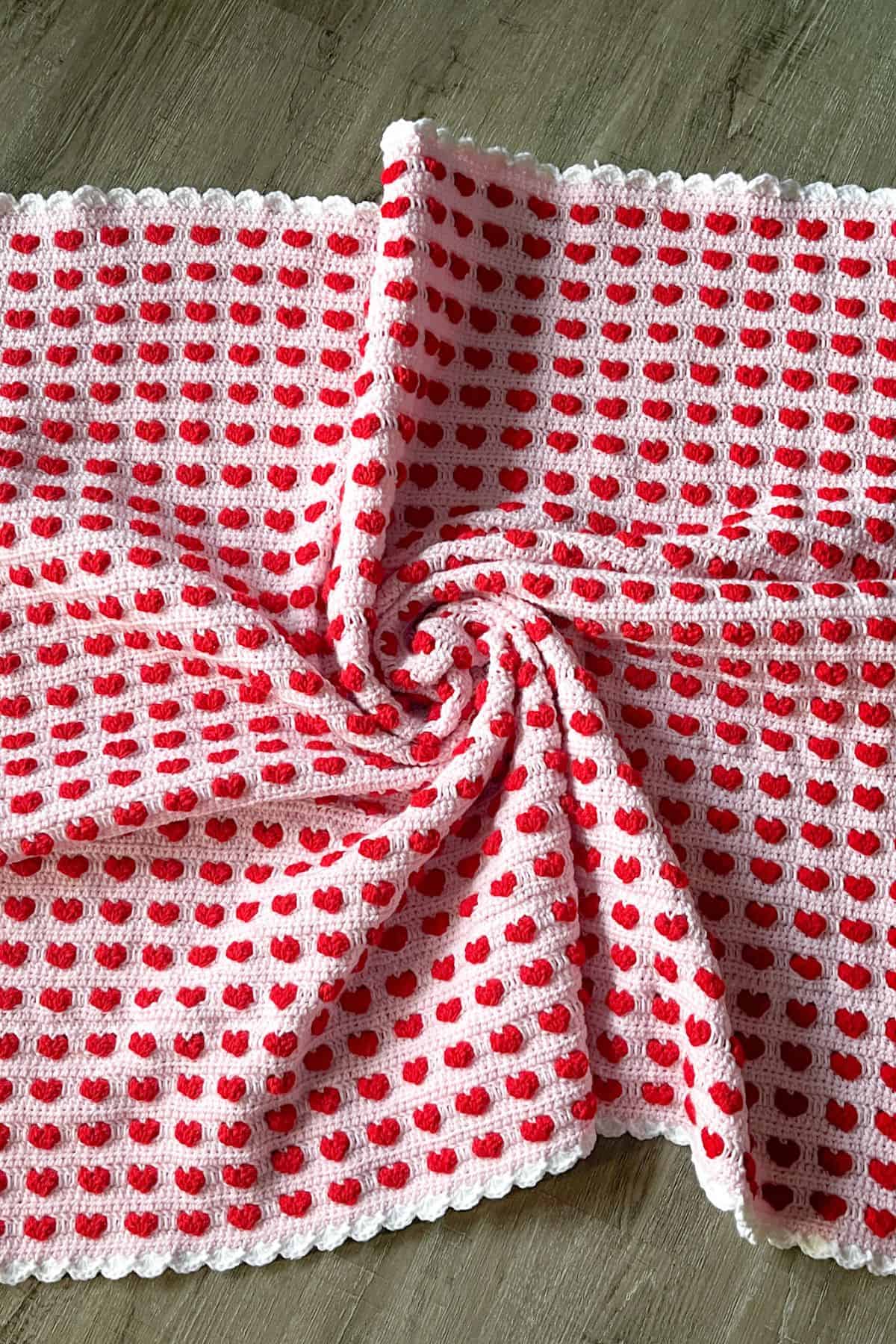 Finished crochet heart blanket pattern.