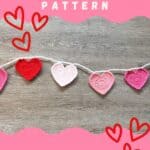 Promo image for the crochet heart garland pattern.