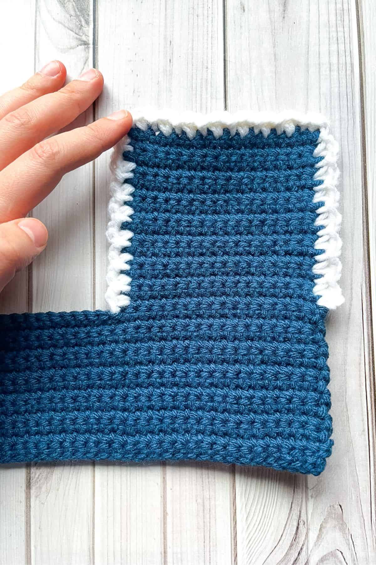 Adding trim to the wallet lid.