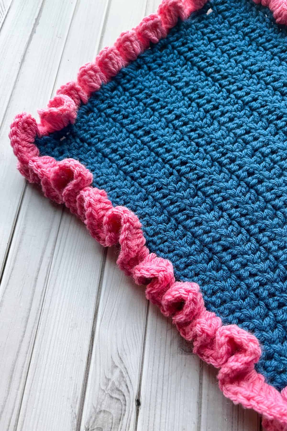 Close up of the finished crochet ruffle border.