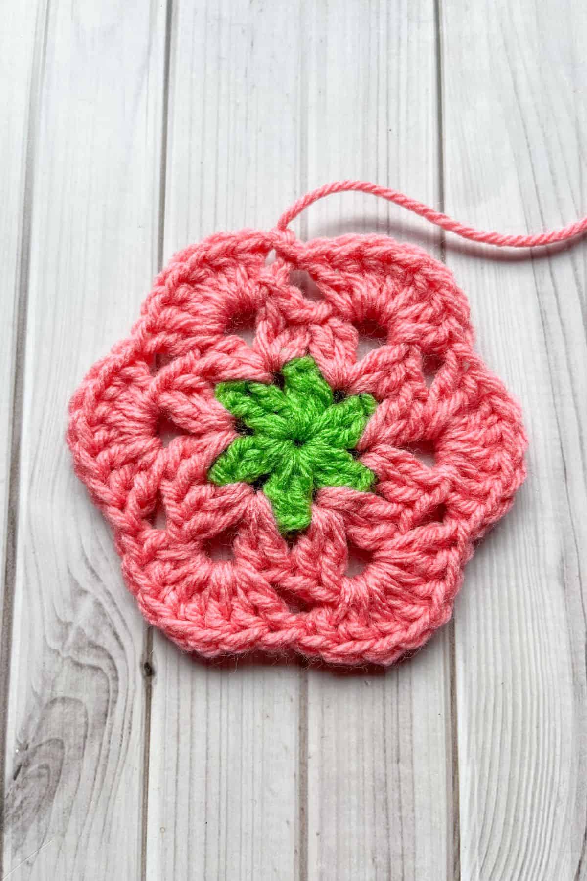 Finished round 3 of the flower hexagon, lays on table.