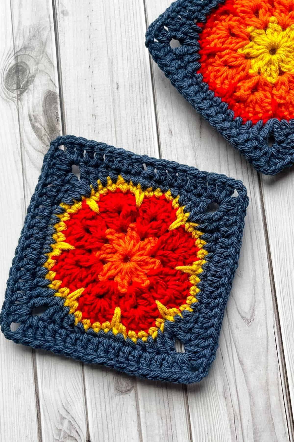Crochet African flower granny squares on table.