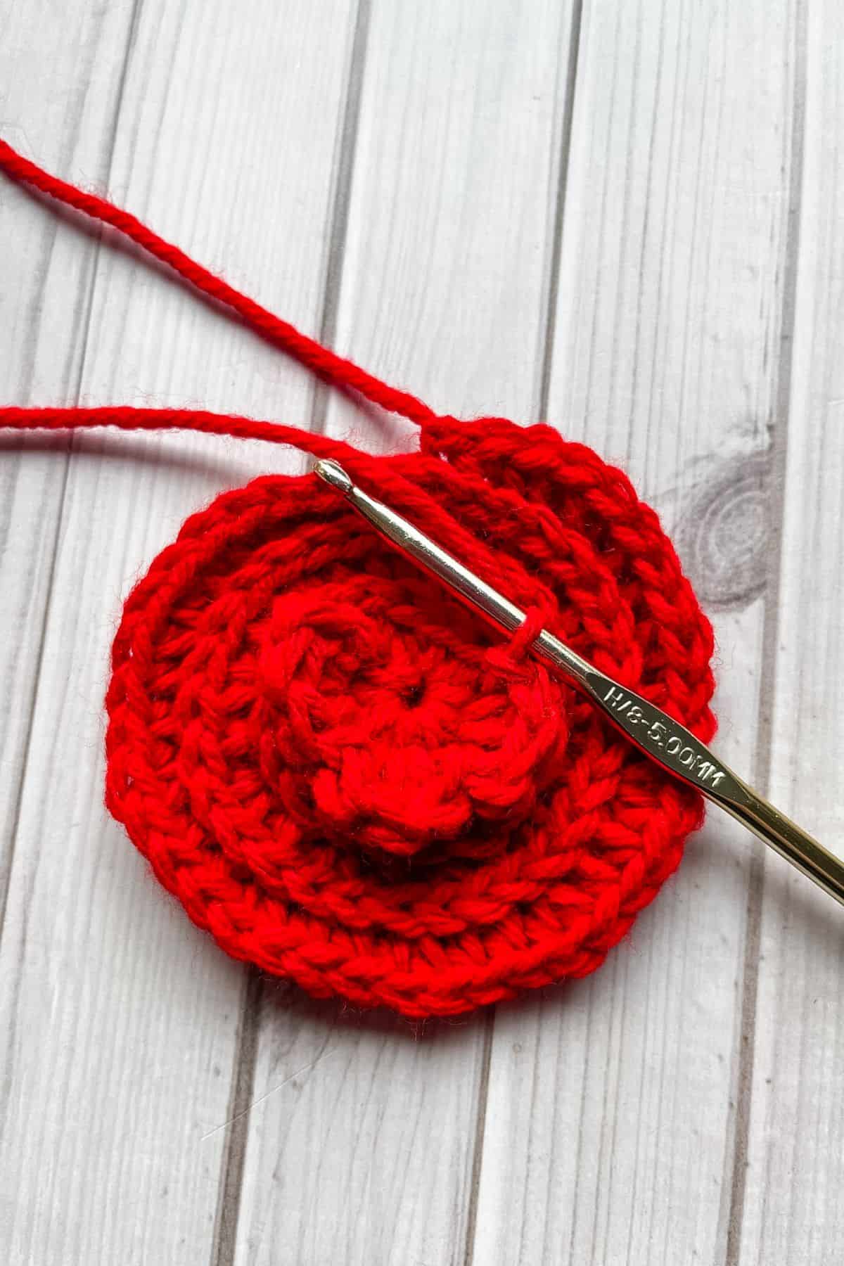 Starting to crochet the flower petals for the rose granny square.