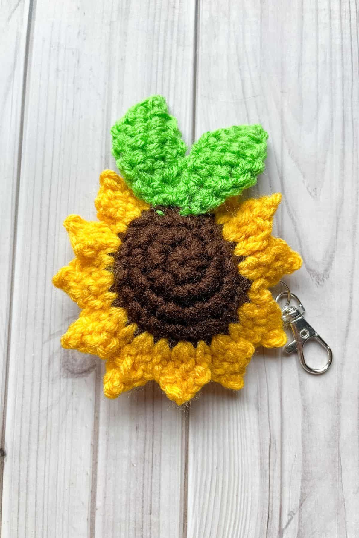 The backside of the crochet sunflower keychain.
