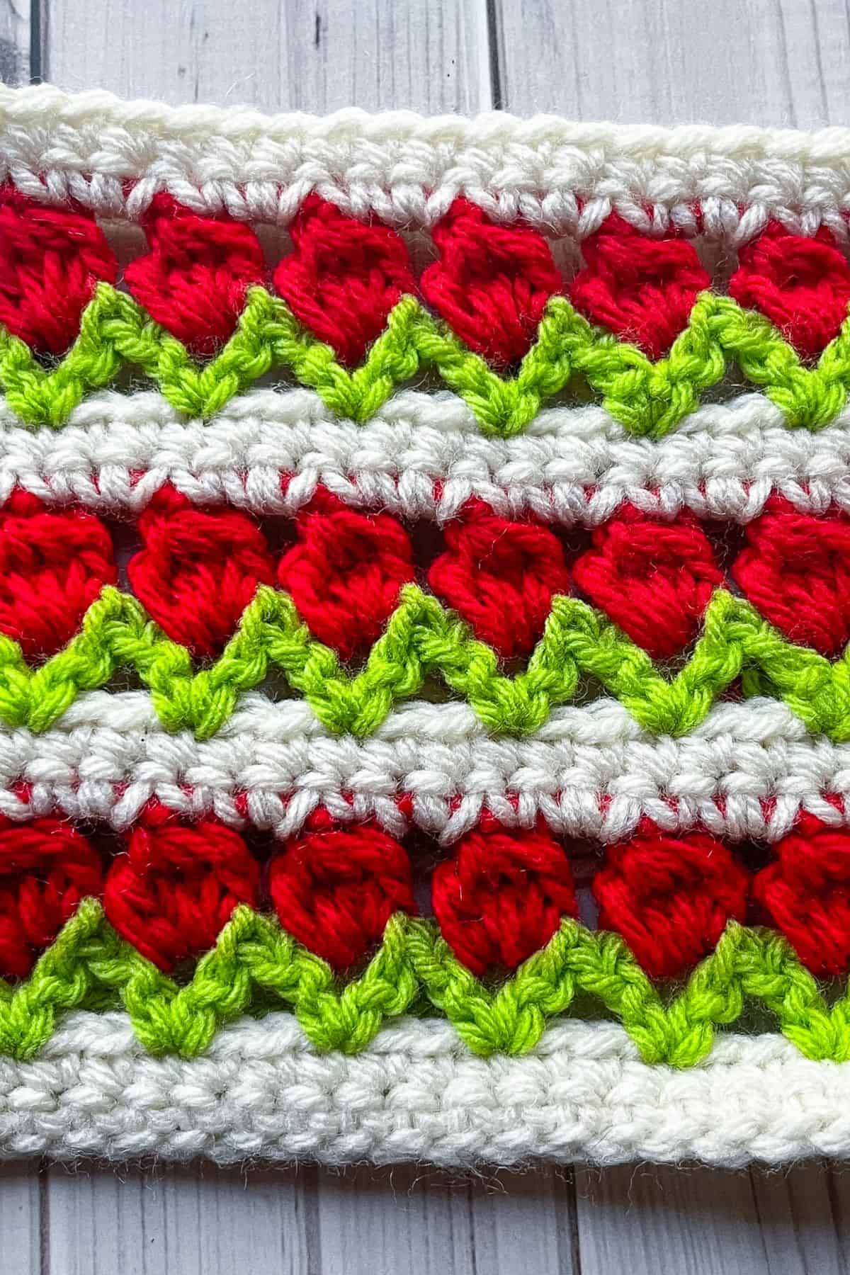 Finished crochet tulip swatch on table.