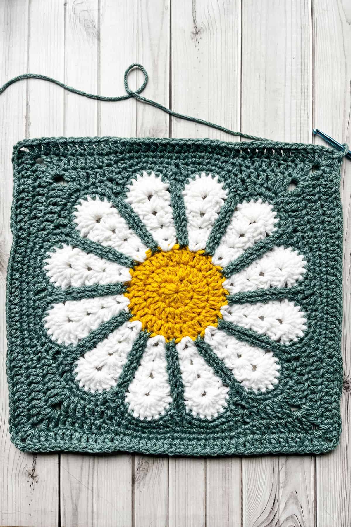 Third round of squaring off the daisy granny square.