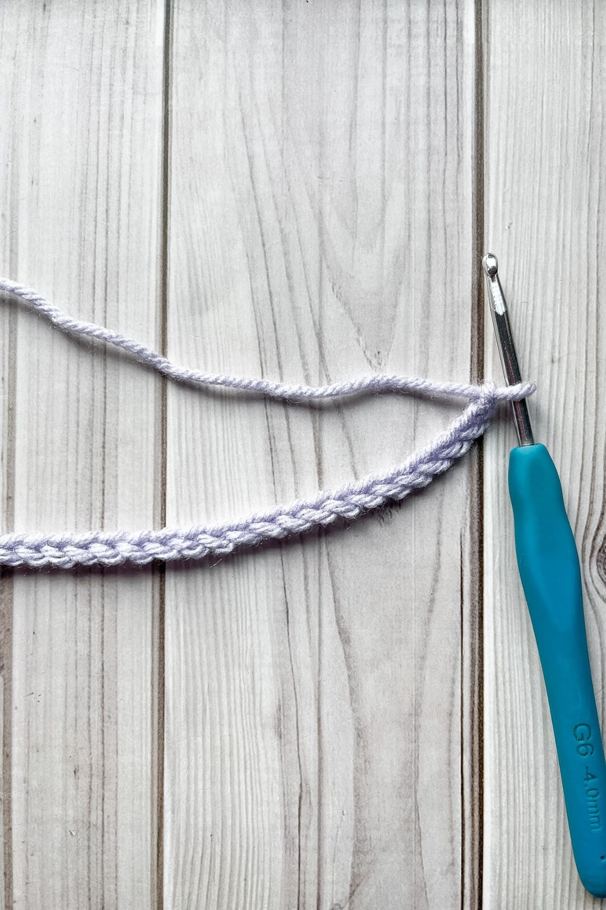 Starting chain with hook on table.