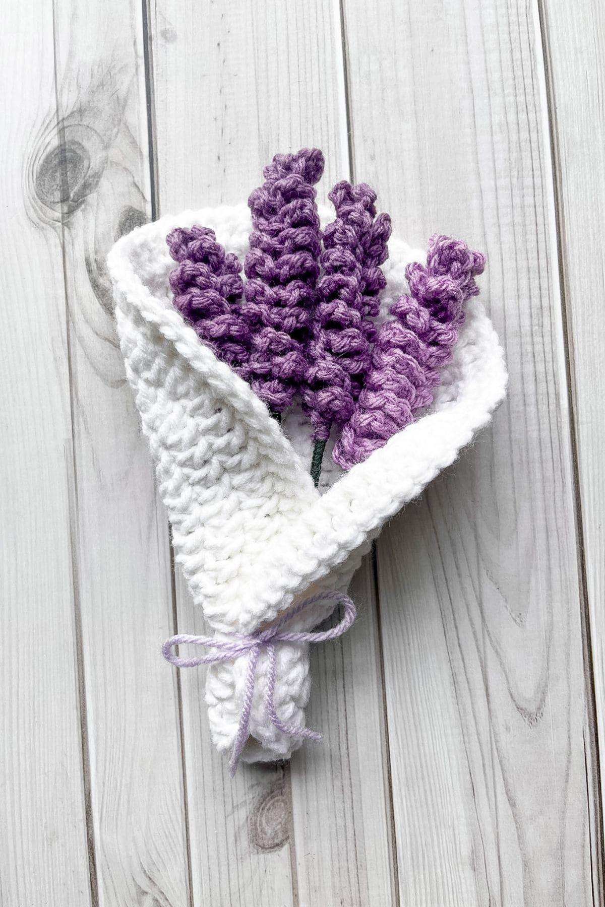 Finished crochet lavender bouquet on table.